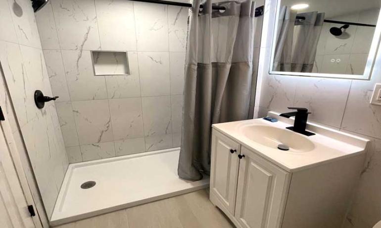 3-Bed Suite with Separate Queen Bed Area (Parking area view)