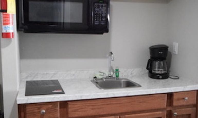 3-Bed Suite with Separate Queen Bed Area (Parking area view)